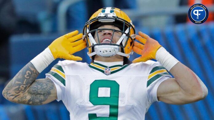 Christian Watson (9) celebrates scoring a touchdown in the fourth quarter against the Chicago Bears.