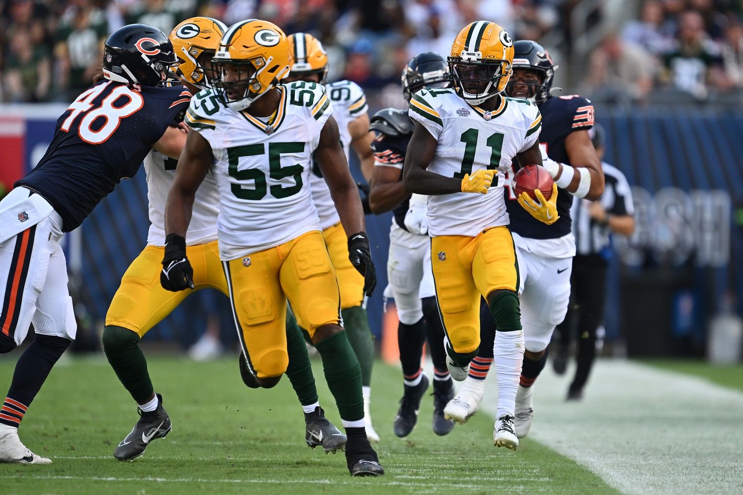 Jayden Reed (11) races up the sideline on a 35-yard punt return in the second half against the Chicago Bears at Soldier Field.