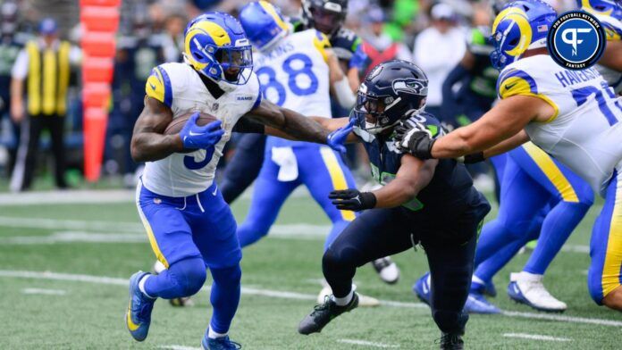 Los Angeles Rams running back Cam Akers (3) stiff arms Seattle Seahawks linebacker Uchenna Nwosu (10) during the second half at Lumen Field.