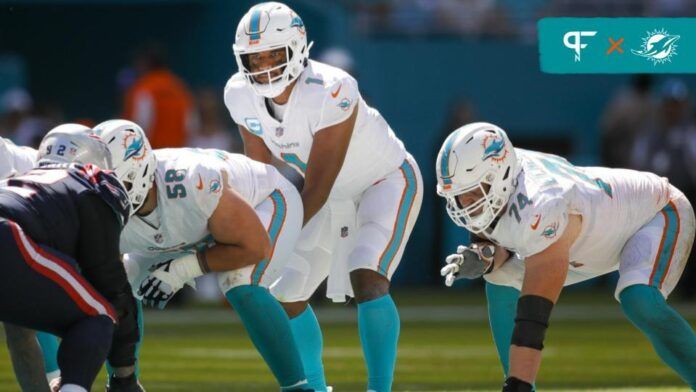 Miami Dolphins quarterback Tua Tagovailoa (1) watches from the line of scrimmage prior to the snap during the fourth quarter against the New England Patriots at Hard Rock Stadium.