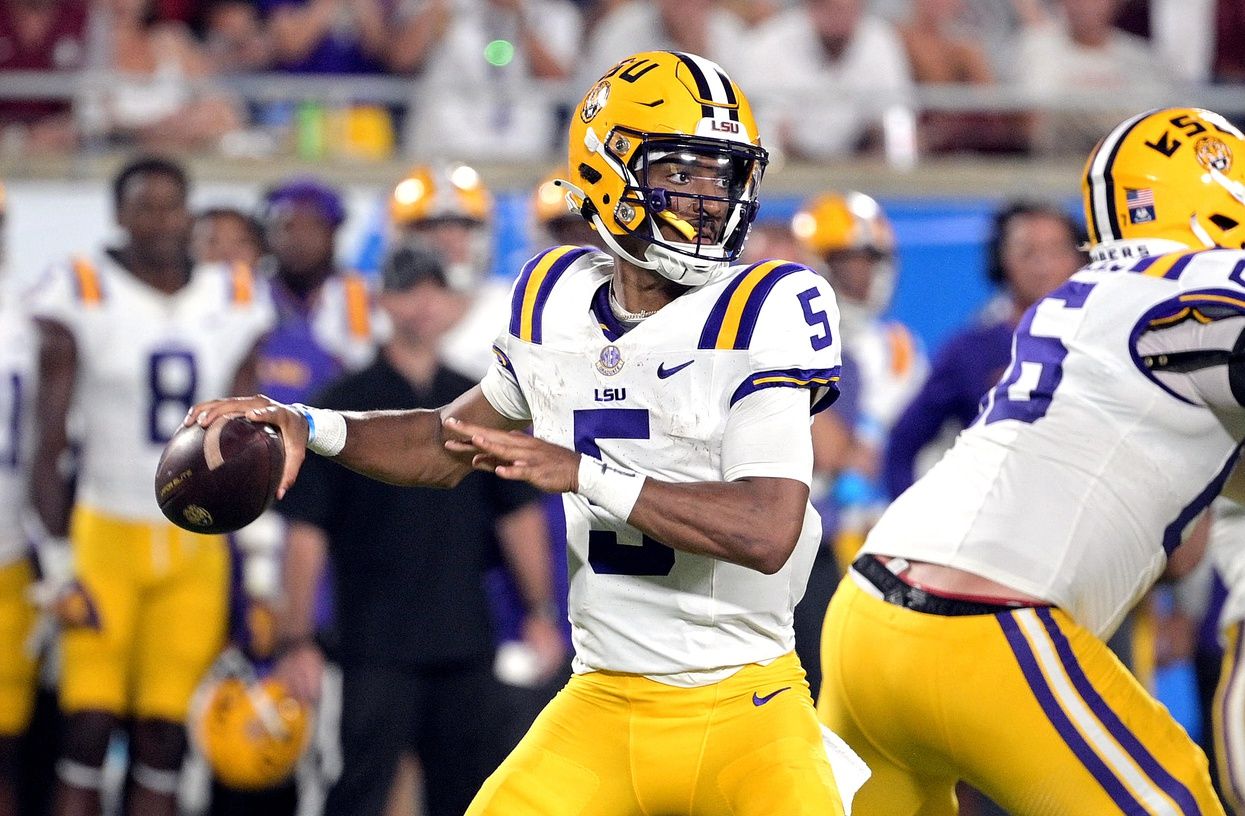 Jayden Daniels (5) looks to pass the ball during the game against the Florida State Seminoles at Camping World Stadium.