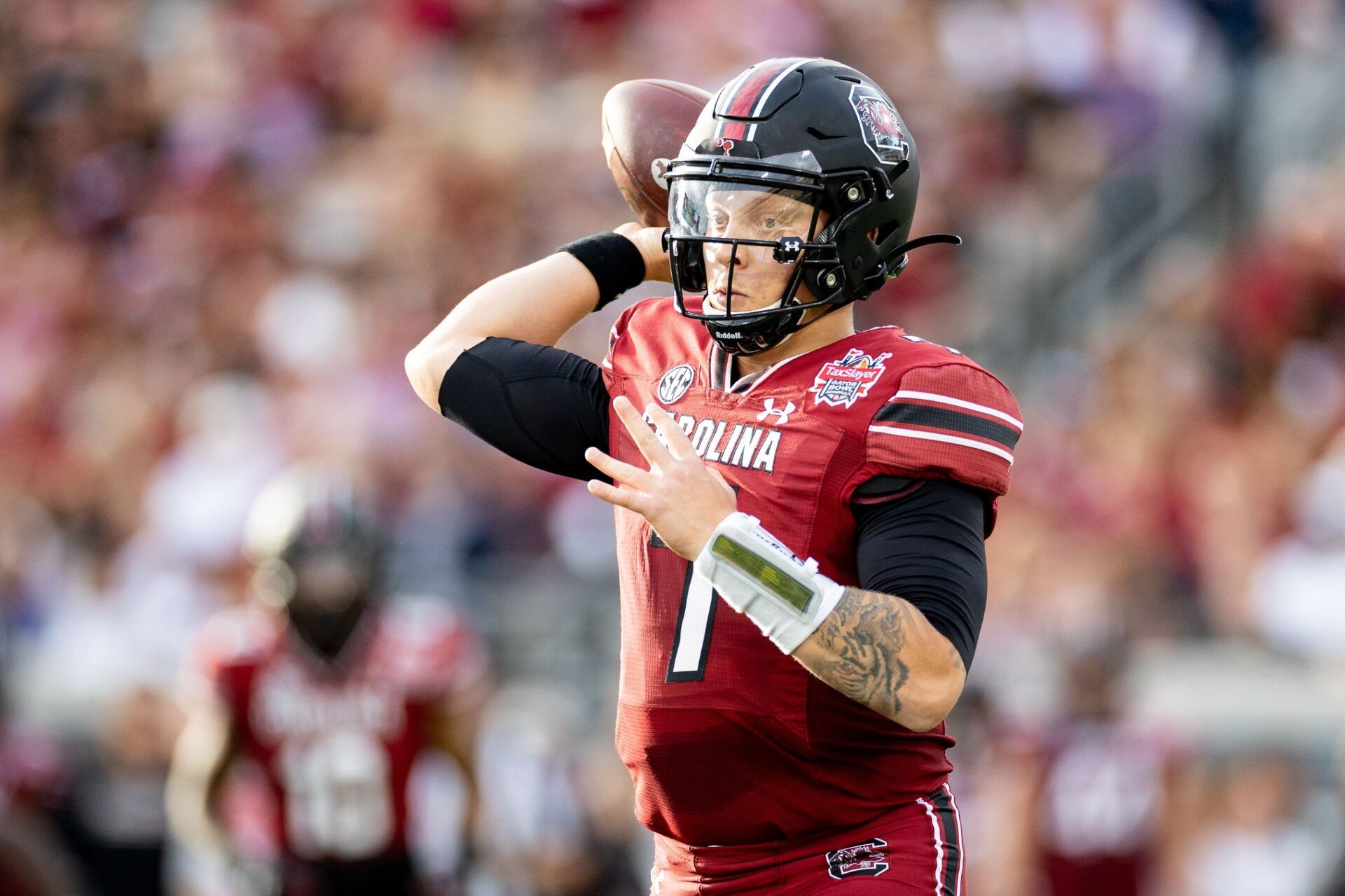 Spencer Rattler (7) throws the ball during the first half against the Notre Dame Fighting Irish in the 2022 Gator Bowl at TIAA Bank Field.