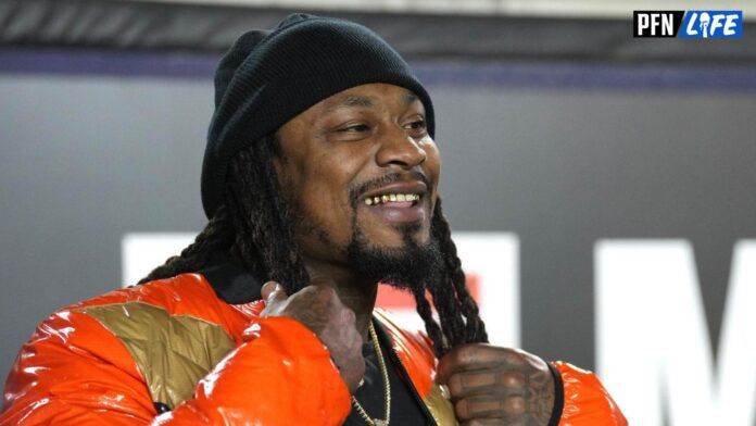 Marshawn Lynch stands on the sideline during the second quarter against the Washington Huskies at FTX Field at California Memorial Stadium.