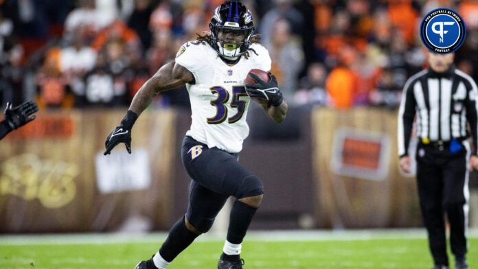 Dec 17, 2022; Cleveland, Ohio, USA; Baltimore Ravens running back Gus Edwards (35) runs the ball against the Cleveland Browns during the second quarter at FirstEnergy Stadium.