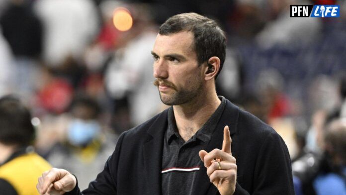 Andrew Luck on hte field before the 2022 CFP college football national championship game between the Alabama Crimson Tide and the Georgia Bulldogs at Lucas Oil Stadium.