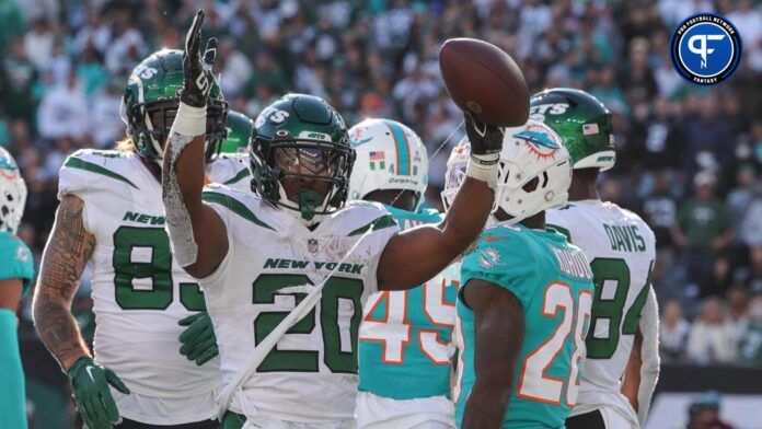 Jets RB Breece Hall celebrates after TD vs. the Miami Dolphins.