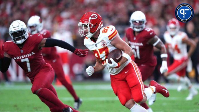 Kansas City Chiefs tight end Travis Kelce (87) runs against Arizona Cardinals linebacker Kyzir White (7) during the first half at State Farm Stadium.