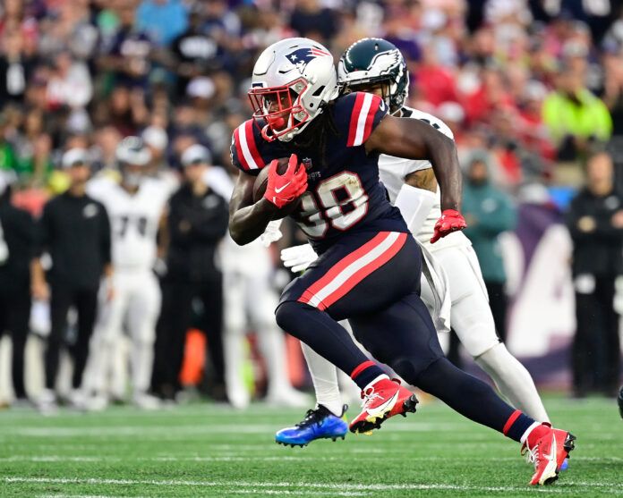 New England Patriots running back Rhamondre Stevenson (38) runs the ball against the Philadelphia Eagles during the second half at Gillette Stadium.