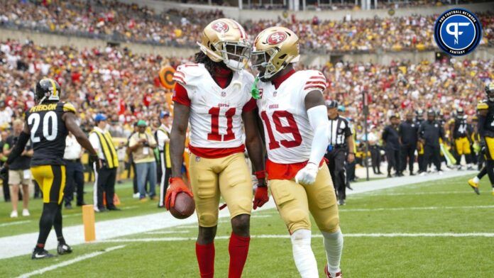 San Francisco 49ers WRs Brandon Aiyuk (11) and Deebo Samuel (19) celebrate after a touchdown.