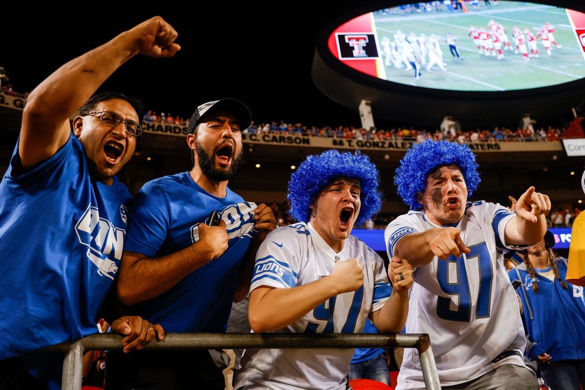 Detroit Lions fans celebrate after the team's win over the Kansas City Chiefs.