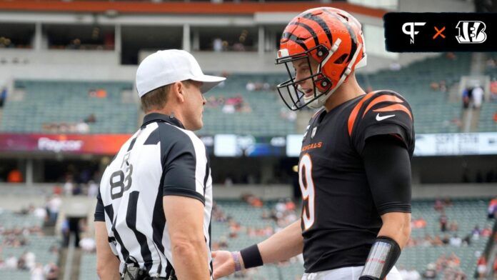 Cincinnati Bengals quarterback Joe Burrow (9) talks with referee Shawn Hochuli (83) prior to a Week 2 NFL football game between the Baltimore Ravens and the Cincinnati Bengals.