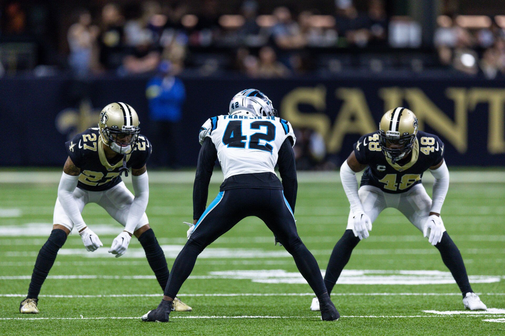 Carolina Panthers safety Sam Franklin Jr. (42) waits for the punt against New Orleans Saints cornerback Alontae Taylor (27) and safety J.T. Gray (48) during the second half at Caesars Superdome.