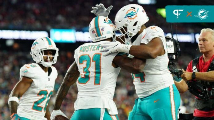 Raheem Mostert (31) is congratulated after his touchdown against New England Patriots in the second quarter at Gillette Stadium.