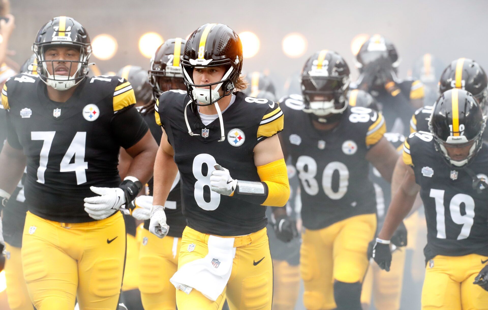 Kenny Pickett (8) leads the offense onto the field to play the San Francisco 49ers at Acrisure Stadium.