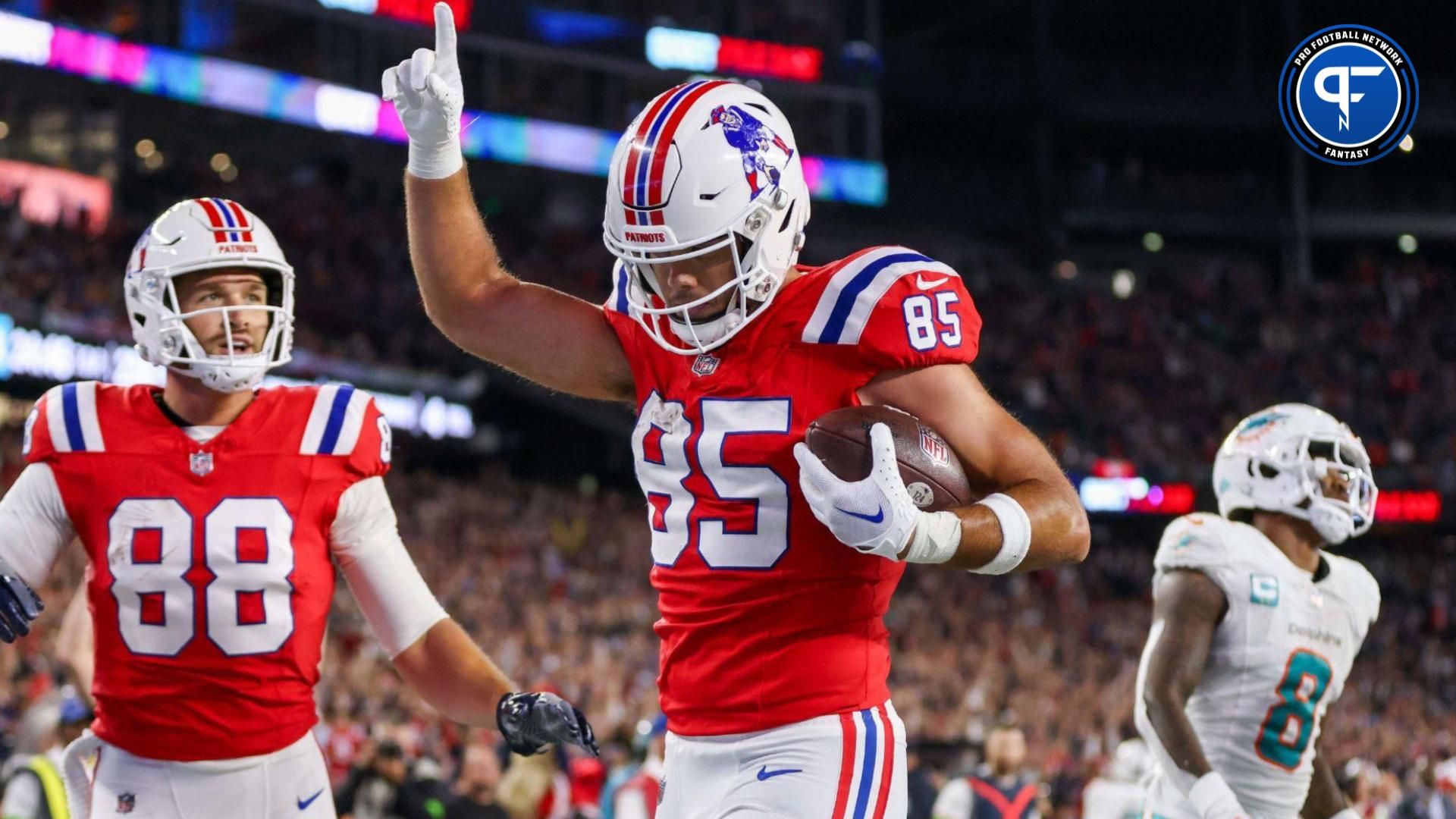 New England Patriots tight end Hunter Henry (85) celebrates after scoring a touchdown during the second half against the Miami Dolphins at Gillette Stadium.