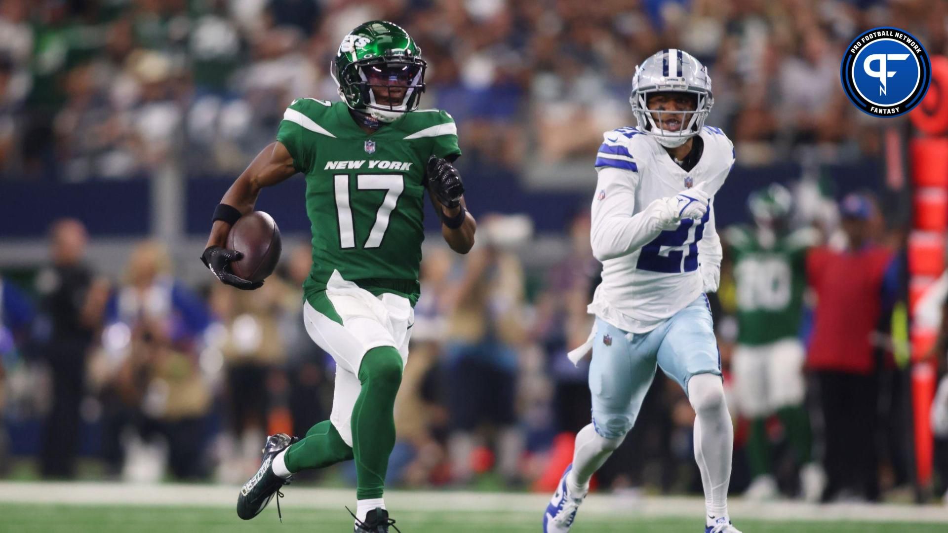 Garrett Wilson (17) runs for a touchdown against Dallas Cowboys cornerback Stephon Gilmore (21) in the second quarter at AT&T Stadium.