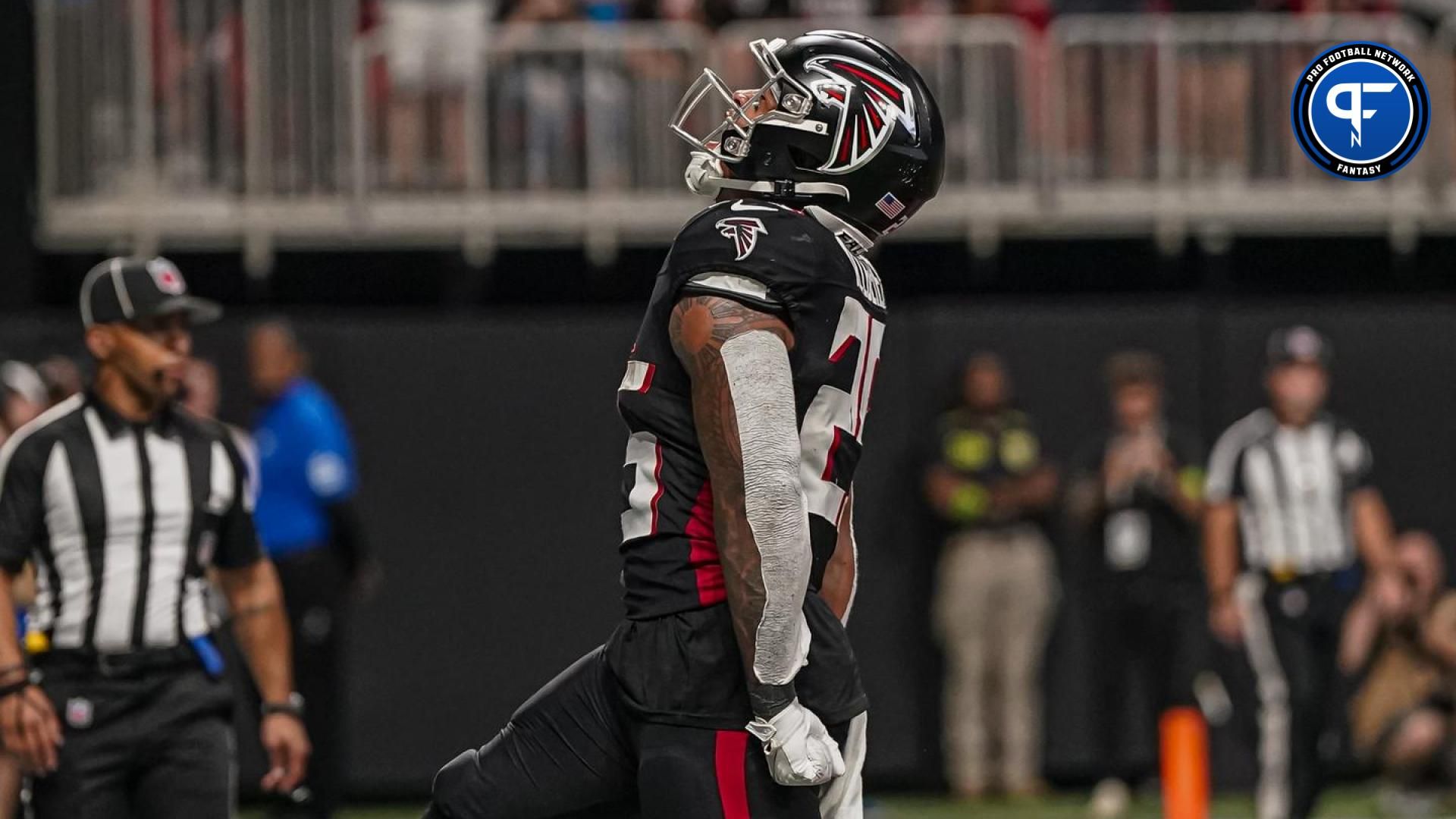 Tyler Allgeier (25) reacts after scoring a touchdown against the Carolina Panthers during the second half at Mercedes-Benz Stadium.