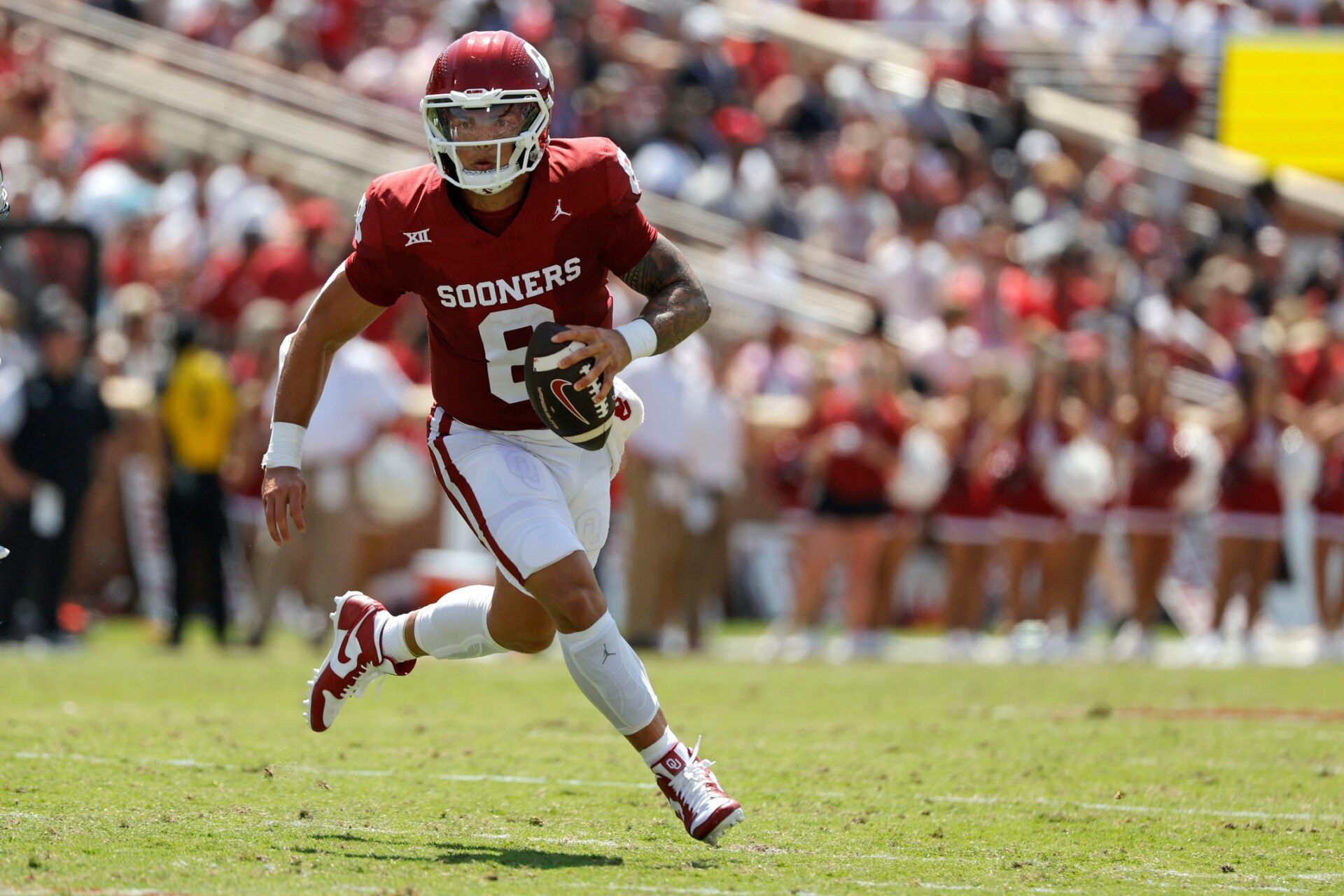 Oklahoma QB Dillion Gabriel runs with the football against Arkansas State.