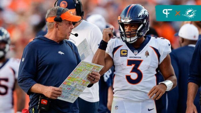 Denver Broncos head coach Sean Payton talks with quarterback Russell Wilson (3) in the fourth quarter against the Washington Commanders at Empower Field at Mile High.