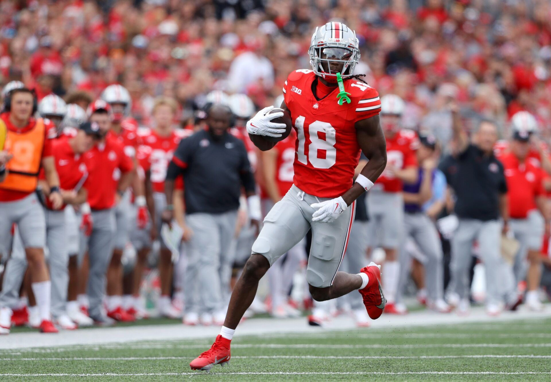 Marvin Harrison Jr. (18) runs after the catch during the first quarter against the Western Kentucky Hilltoppers at Ohio Stadium.