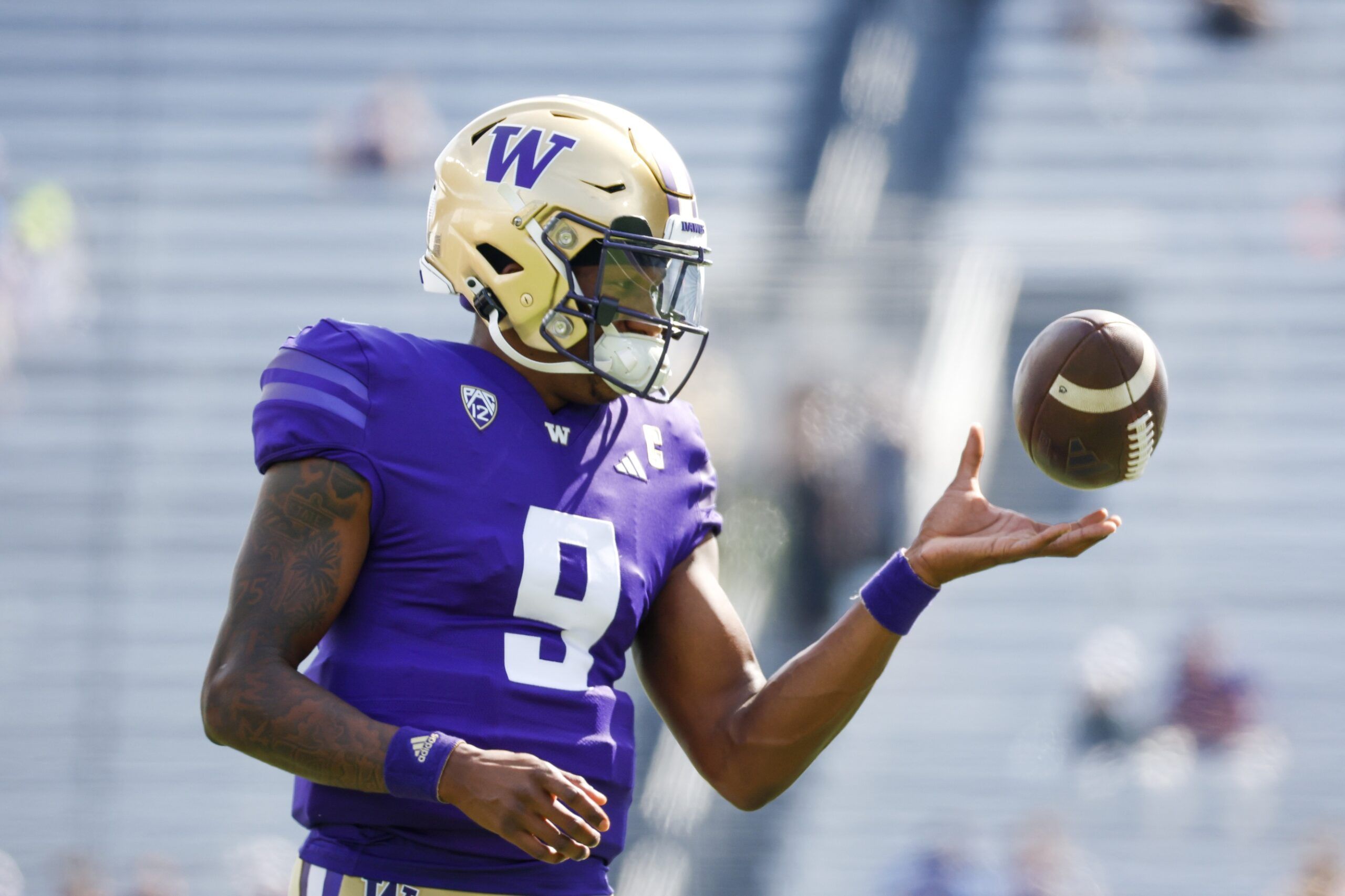 Michael Penix Jr. (9) participates in pregame warmups against the Boise State Broncos at Alaska Airlines Field at Husky Stadium.