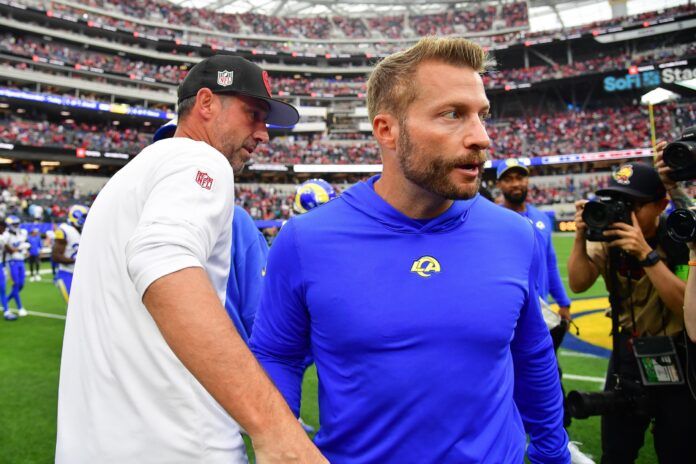 Kyle Shanahan meets with Los Angeles Rams head coach Sean McVay following the victory at SoFi Stadium.