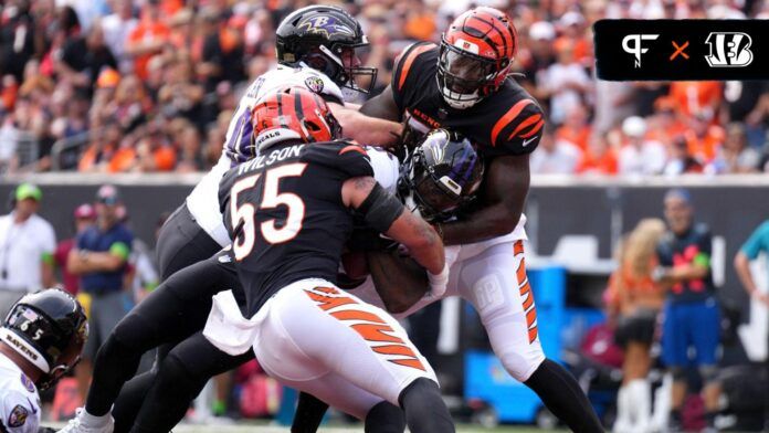 Baltimore Ravens running back Gus Edwards (35) scores a touchdown as Cincinnati Bengals linebacker Logan Wilson (55) and Cincinnati Bengals linebacker Germaine Pratt (57) defend in the first quarter of a Week 2 NFL football game between the Baltimore Ravens and the Cincinnati Bengals Sunday, Sept. 17, 2023, at Paycor Stadium in Cincinnati.