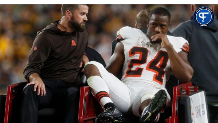 Cleveland Browns running back Nick Chubb (24) is taken from the field on a cart after suffering an apparent injury against the Pittsburgh Steelers during the second quarter at Acrisure Stadium.