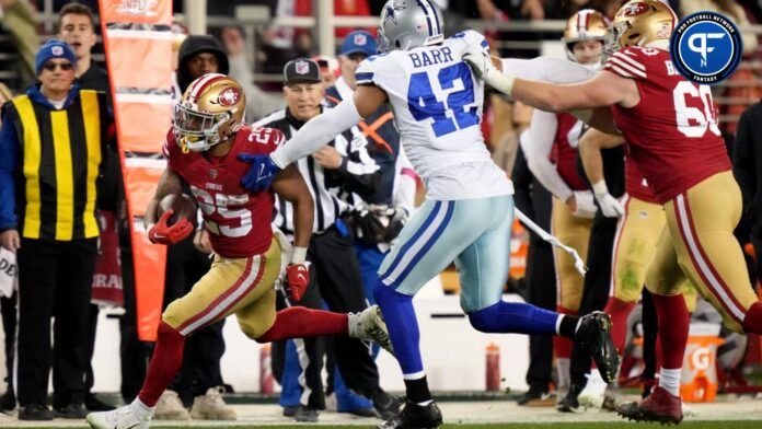 San Francisco 49ers running back Elijah Mitchell (25) runs for a first down during the fourth quarter of a NFC divisional round game against the Dallas Cowboys at Levi's Stadium.