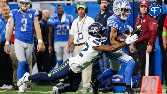 Detroit Lions WR Amon-Ra St. Brown (14) makes a catch against the Seattle Seahawks.