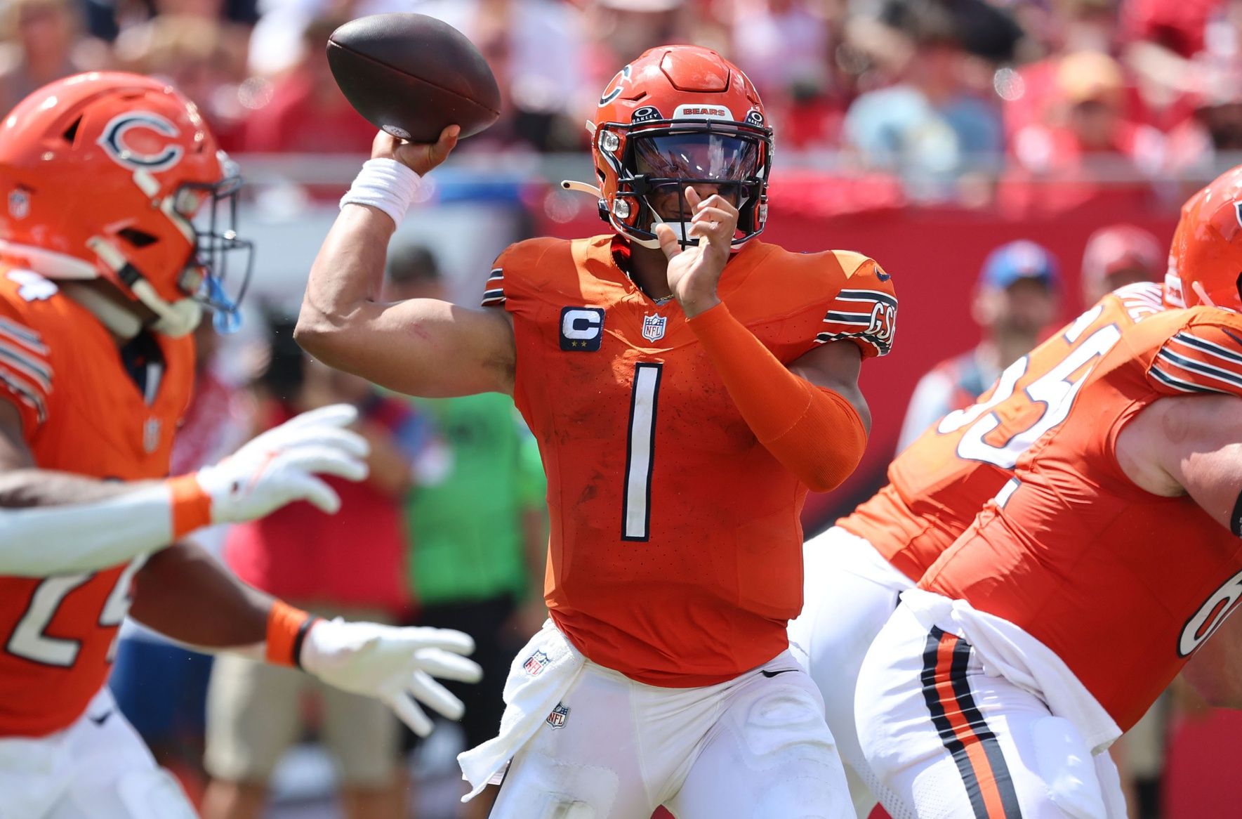 Justin Fields (1) looks to pass during the second half against the Tampa Bay Buccaneers at Raymond James Stadium.