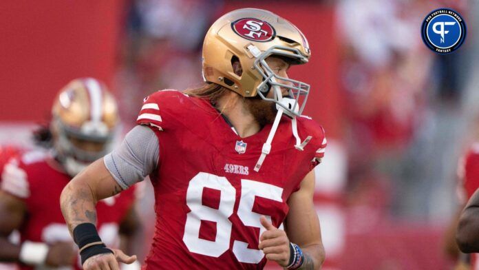 George Kittle (85) runs out of the tunnel before the start of the first quarter against the Los Angeles Chargers at Levi's Stadium.