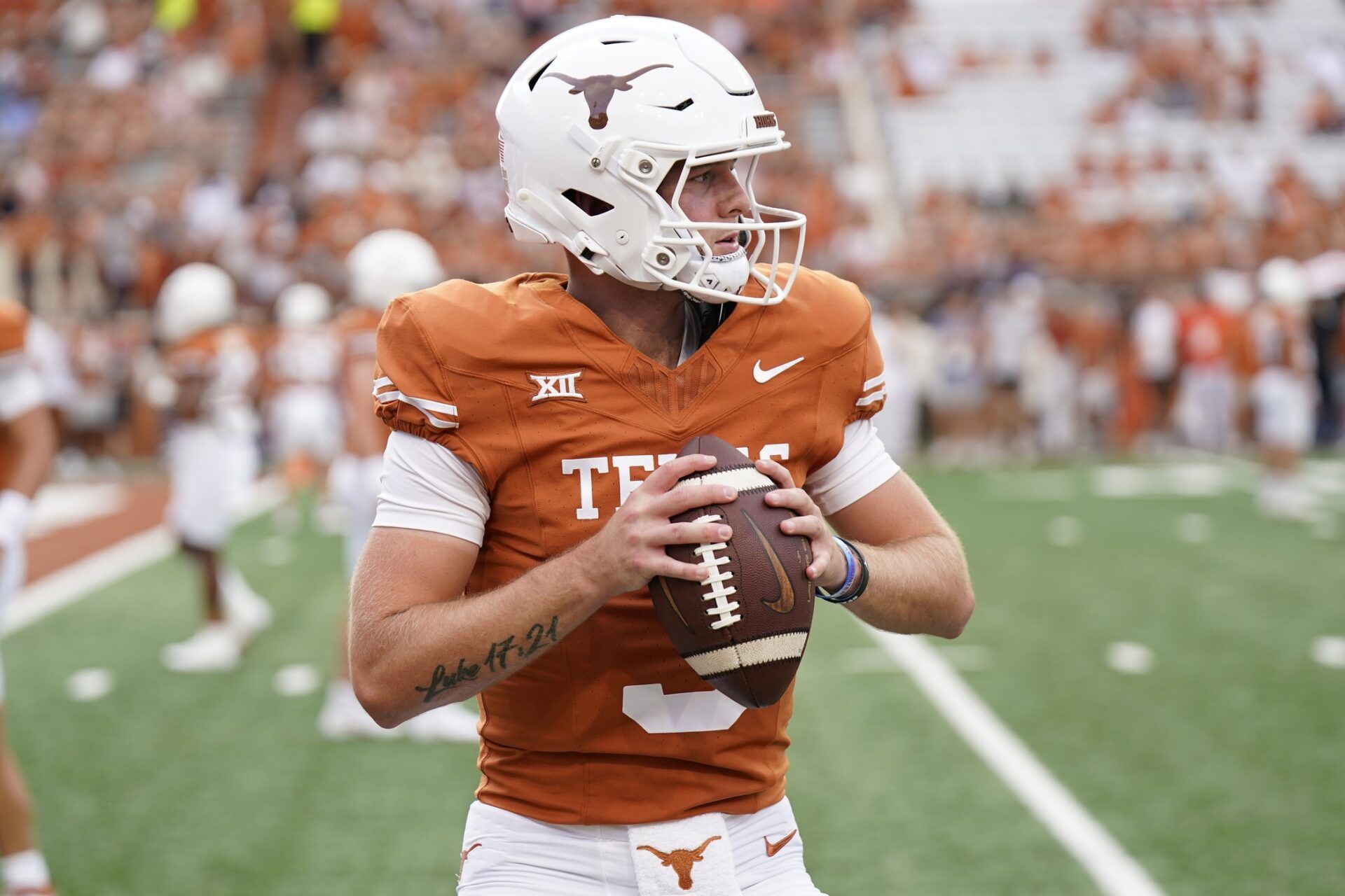 Quinn Ewers (3) warms up before a game against the Wyoming Cowboys at Darrell K Royal-Texas Memorial Stadium.