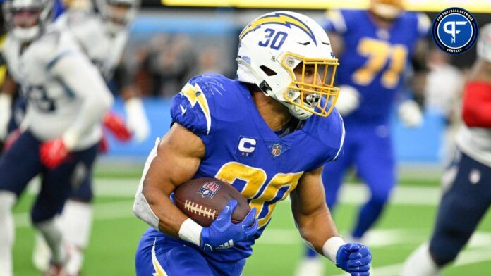 Austin Ekeler (30) carries the ball during the fourth quarter against the Tennessee Titans at SoFi Stadium.