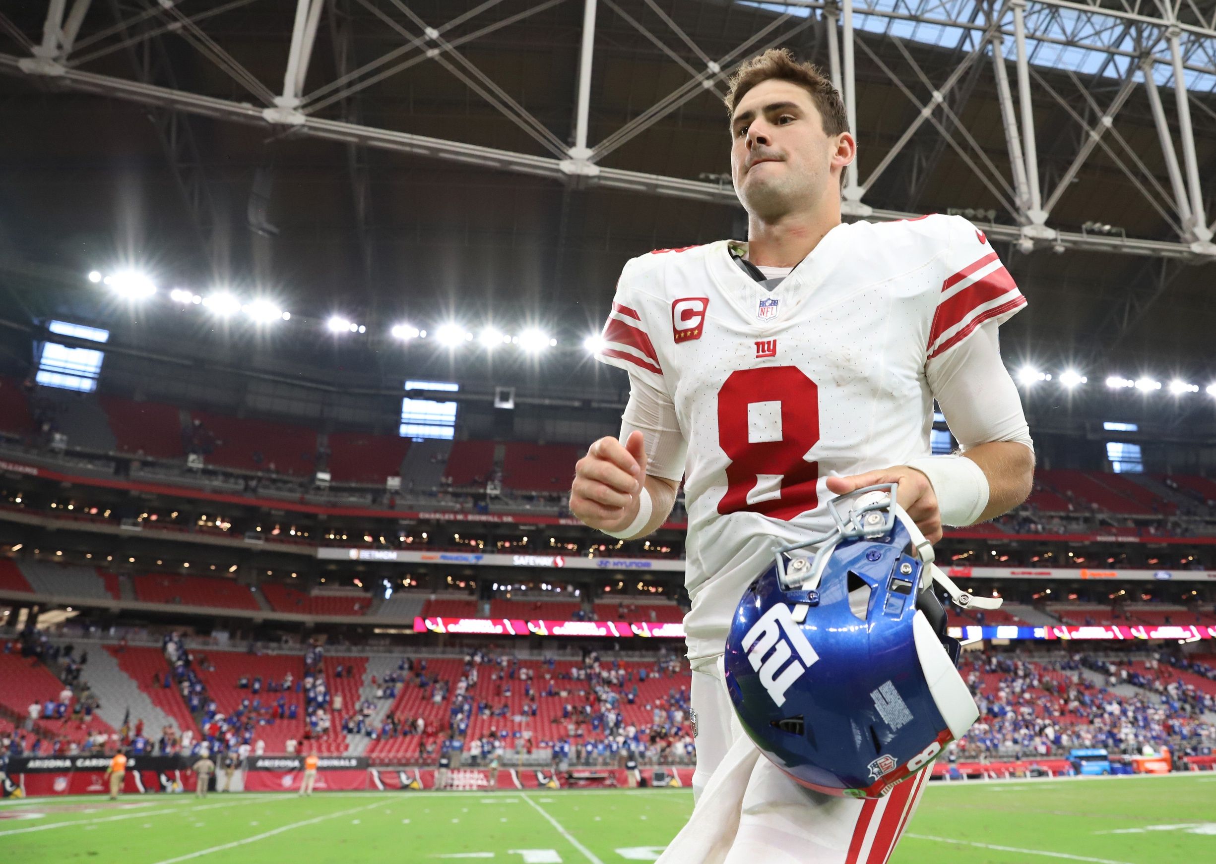 Daniel Jones (8) leaves the field after defeating the Arizona Cardinals at State Farm Stadium.