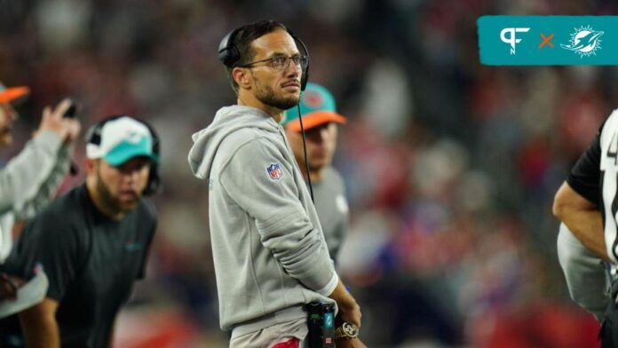 Mike McDaniel watches from the sideline as they take on the New England Patriots at Gillette Stadium.