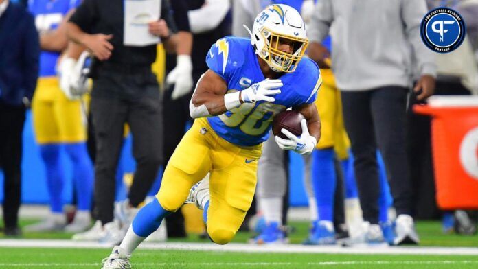 Austin Ekeler (30) runs the ball against the Miami Dolphins during the first half at SoFi Stadium.