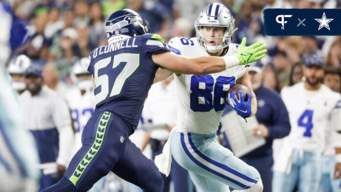 Luke Schoonmaker (86) runs for yards after the catch against Seattle Seahawks linebacker Patrick O'Connell (57) during the third quarter at Lumen Field.