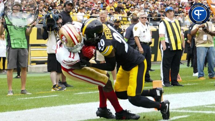 San Francisco 49ers wide receiver Brandon Aiyuk being tackled in the end zone by Patrick Peterson.