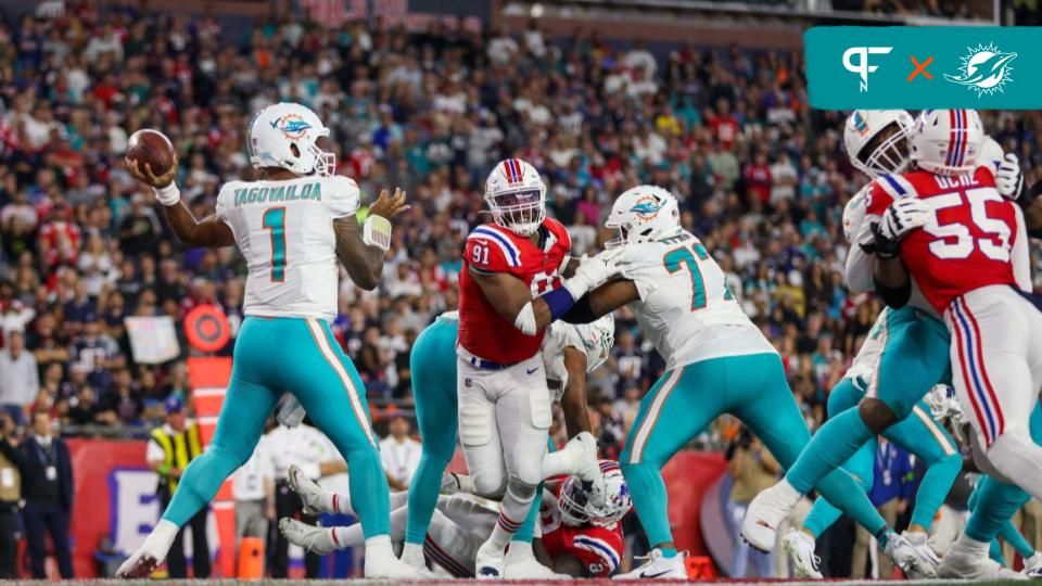 The Miami Dolphins offensive line blocks for QB Tua Tagovailoa (1) against the New England Patriots.