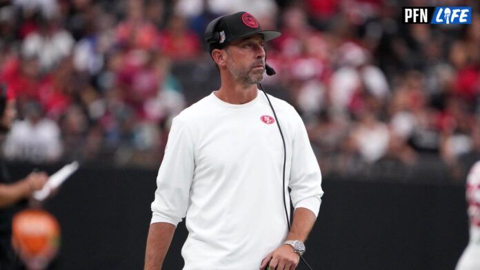 Kyle Shanahan watches from the sidelines against the Las Vegas Raiders at Allegiant Stadium.