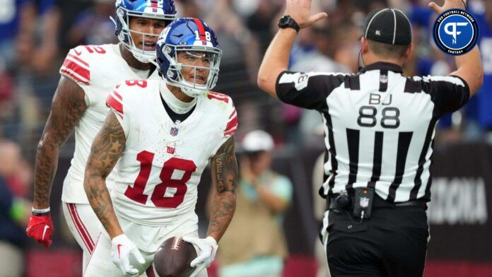 Isaiah Hodgins (18) celebrates a touchdown against the Arizona Cardinals during the second half at State Farm Stadium.