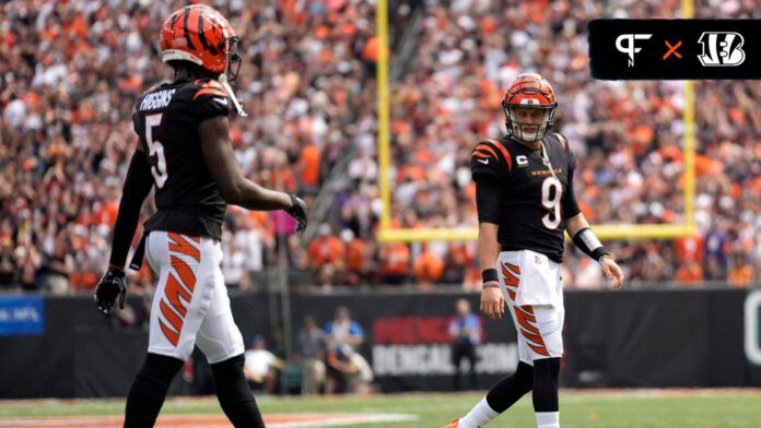 Cincinnati Bengals quarterback Joe Burrow (9) looks toward Cincinnati Bengals wide receiver Tee Higgins (5) while coming off the field in the second quarter of a Week 2 NFL football game between the Baltimore Ravens and the Cincinnati Bengals