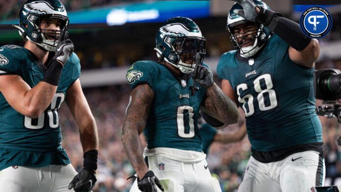 Philadelphia Eagles running back D'Andre Swift celebrates a score with teammates Dallas Goedert and Jordan Mailata.