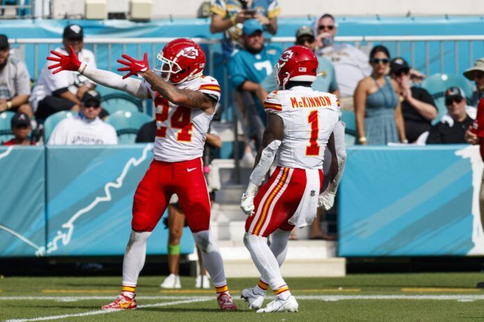 Kansas City Chiefs wide receiver Skyy Moore and running back Jerick McKinnon celebrate a big play.