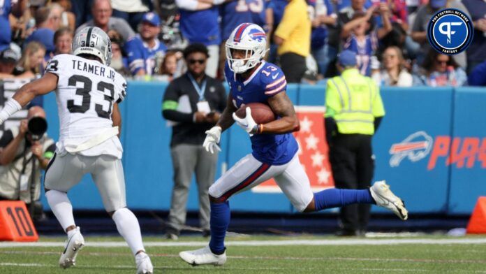 Bills receiver Gabe Davis looks to get past Raiders Roderic Teamer.