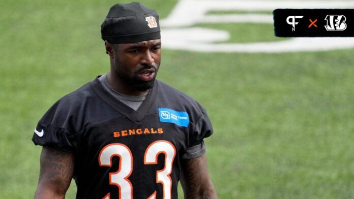 Nick Scott (33) walks between drills during an off-season workout inside Paycor Stadium in downtown Cincinnati.