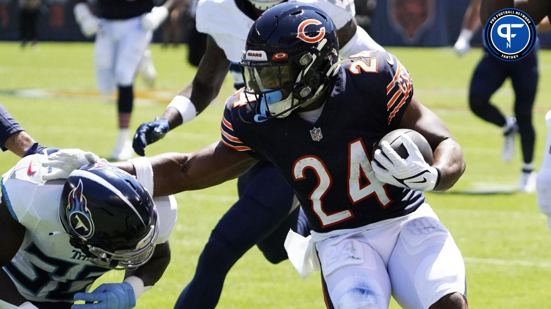 Khalil Herbert (24) catches a pass and runs for a touchdown against Tennessee Titans cornerback Chris Jackson (35) during the first quarter at Soldier Field.