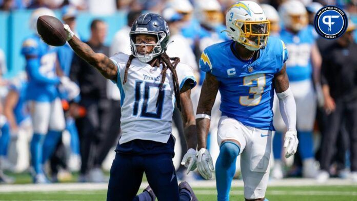 DeAndre Hopkins (10) celebrates receiving a pass next to Los Angeles Chargers safety Derwin James Jr. (3) during the fourth quarter at Nissan Stadium.