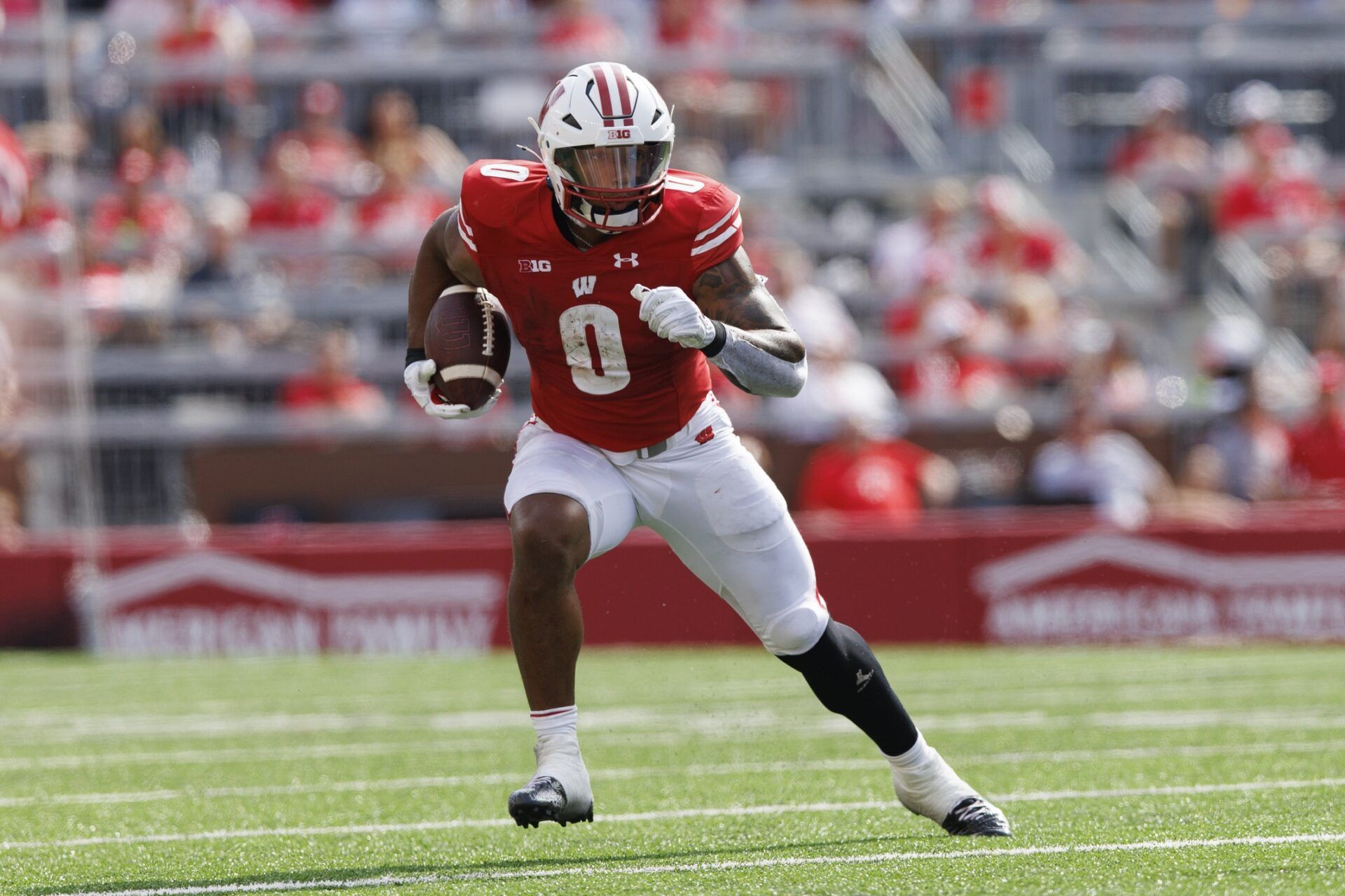 Braelon Allen (0) rushes with the football during the second quarter against the Buffalo Bulls at Camp Randall Stadium.